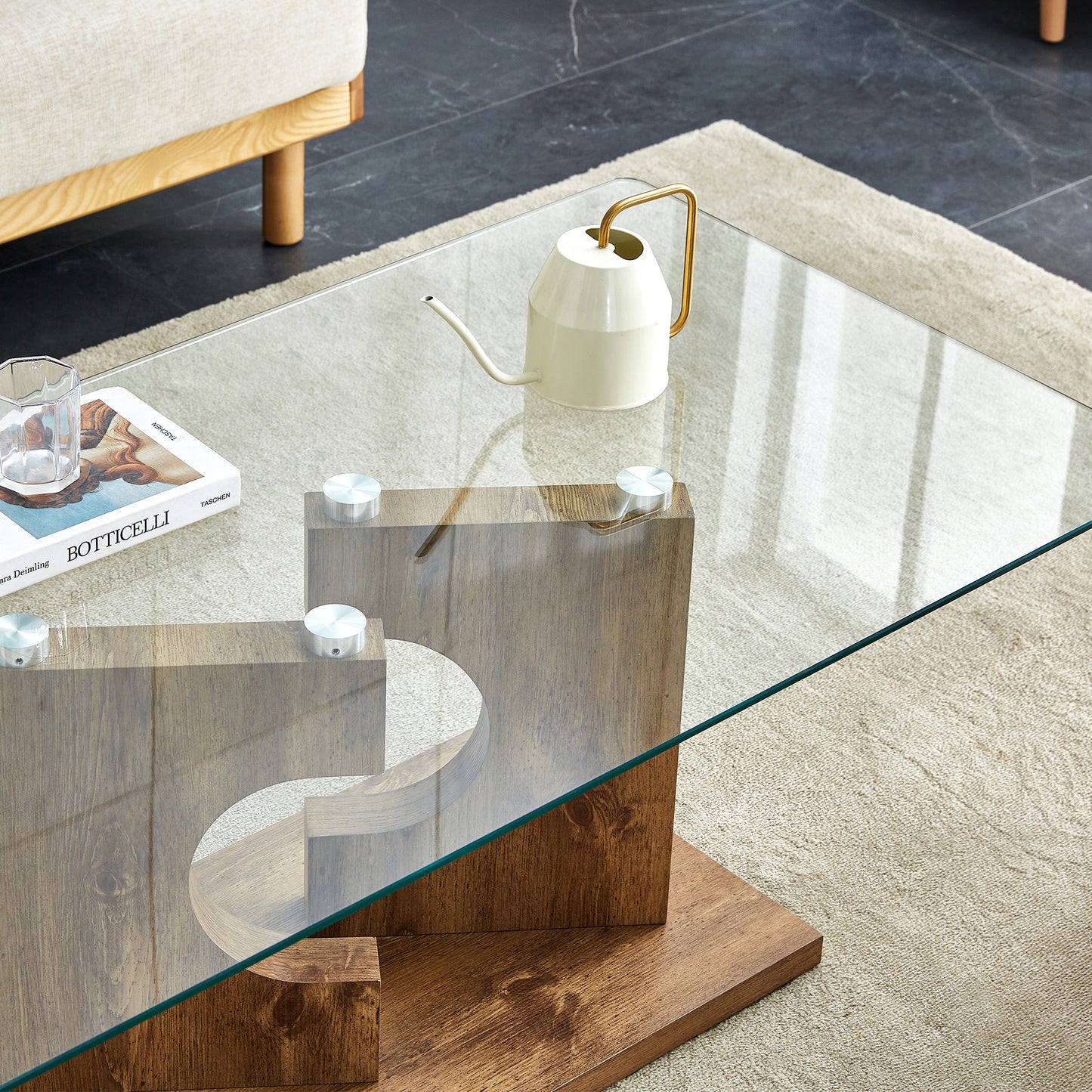 A rectangular modern and fashionable coffee table with tempered glass tabletop and wooden color MDF legs. Suitable for living room.47.2"*25.5"*18"