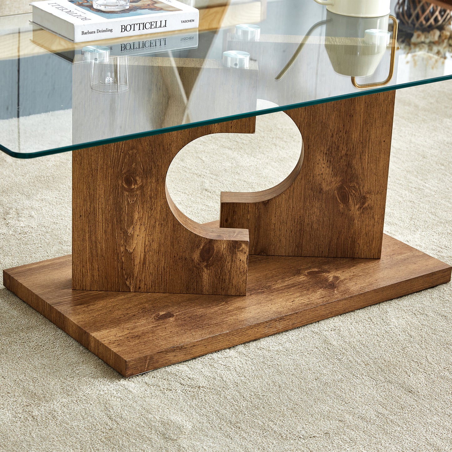 A rectangular modern and fashionable coffee table with tempered glass tabletop and wooden color MDF legs. Suitable for living room.47.2"*25.5"*18"